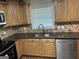 Renovated kitchen with granite countertops, stainless steel appliances and ample cabinet space at 113 Ausband Dr, Mcdonough, GA 30253