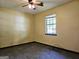 Bright bedroom with carpet, ceiling fan and natural light at 6698 Cameron Rd, Morrow, GA 30260