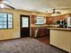 Cozy kitchen with wood cabinets, stainless steel appliances, and view to outside at 6698 Cameron Rd, Morrow, GA 30260