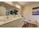 Beautiful bathroom featuring a double vanity with quartz countertop and modern fixtures at 221 Ashley Oaks Dr, Mcdonough, GA 30253