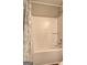 Clean, bright bathroom features a standard shower-tub combo with modern fixtures and shower curtain at 221 Ashley Oaks Dr, Mcdonough, GA 30253