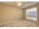 Neutral bedroom with carpeted floor, overhead light, and large window at 221 Ashley Oaks Dr, Mcdonough, GA 30253