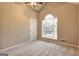 Carpeted bedroom with arched window and closet at 221 Ashley Oaks Dr, Mcdonough, GA 30253