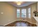 Sun-filled breakfast nook with large windows and wood-look flooring at 221 Ashley Oaks Dr, Mcdonough, GA 30253
