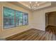 Spacious dining room with ample natural light and elegant chandelier at 221 Ashley Oaks Dr, Mcdonough, GA 30253