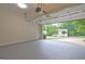 Two-car garage features open garage door and beautiful views of the neighborhood at 221 Ashley Oaks Dr, Mcdonough, GA 30253