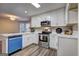 Bright kitchen with white cabinets, stainless steel appliances, and a large island for prep space at 221 Ashley Oaks Dr, Mcdonough, GA 30253