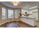 Well-lit kitchen adjacent to dining area boasts bright cabinetry and ample counter space at 221 Ashley Oaks Dr, Mcdonough, GA 30253
