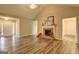 Open-concept living room featuring vaulted ceilings, a cozy fireplace, and seamless flooring at 221 Ashley Oaks Dr, Mcdonough, GA 30253