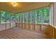 Inviting screened-in porch surrounded by lush greenery at 221 Ashley Oaks Dr, Mcdonough, GA 30253