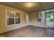 Cozy screened porch with wooden floors and ample natural light at 221 Ashley Oaks Dr, Mcdonough, GA 30253