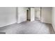 Comfortable bedroom with gray carpeting and a decorative fireplace feature at 5166 Avery Sw St, Covington, GA 30014