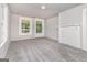 Spacious bedroom with neutral walls, gray carpeting, and plenty of natural light at 5166 Avery Sw St, Covington, GA 30014