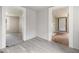 Hallway showcasing new gray flooring and transitions to other rooms in the home at 5166 Avery Sw St, Covington, GA 30014