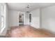 Bright living room featuring hardwood floors, neutral walls, and ample natural light at 5166 Avery Sw St, Covington, GA 30014