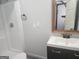 This bathroom features a shower with a white enclosure and a vanity with a rectangular sink at 2615 Old South Ct, Jonesboro, GA 30236