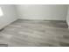 Bedroom featuring neutral decor, new flooring, and natural light from a large window at 2615 Old South Ct, Jonesboro, GA 30236