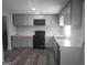 Modern kitchen with updated appliances, new countertops, and ample cabinet space at 2615 Old South Ct, Jonesboro, GA 30236