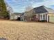 Spacious back yard, surrounded by fencing and mature trees, perfect for outdoor activities at 410 Oakpark Ter, Mcdonough, GA 30253