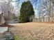Expansive back yard featuring mature trees, ideal for outdoor enjoyment at 410 Oakpark Ter, Mcdonough, GA 30253