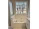 Clean soaking tub with a window at 410 Oakpark Ter, Mcdonough, GA 30253