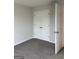 Bedroom features neutral paint, carpet, and a closet with double doors, providing a cozy, versatile space at 410 Oakpark Ter, Mcdonough, GA 30253