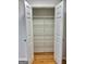 Walk-in closet with ample shelving for organized storage at 410 Oakpark Ter, Mcdonough, GA 30253