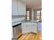 Well-appointed kitchen island featuring granite countertops, stainless steel dishwasher at 410 Oakpark Ter, Mcdonough, GA 30253
