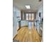 Open kitchen layout featuring modern appliances, granite counters, and white cabinets at 410 Oakpark Ter, Mcdonough, GA 30253