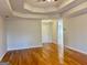 Living room with hardwood floors provides a versatile space, ready for your personal touch and decor at 410 Oakpark Ter, Mcdonough, GA 30253