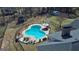 Expansive backyard featuring an in-ground pool, outbuildings, playhouse, and mature trees at 809 Mcbean Ct, Mcdonough, GA 30252