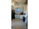 View of the kitchen featuring a black fridge, cabinets, sink and flooring at 1730 Emerald Sw Ave, Atlanta, GA 30310