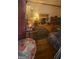 View of the living room showing a fireplace, hardwood floors, and furniture at 1730 Emerald Sw Ave, Atlanta, GA 30310
