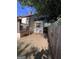 The back of a house, wooden fence, with some greenery outside at 1132 Se Oak Knoll Ter, Atlanta, GA 30315