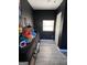 Cozy room with dark walls, light wood floors and a small window next to the white door at 1132 Se Oak Knoll Ter, Atlanta, GA 30315
