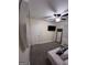 Contemporary bedroom with wall-mounted TV, full-length mirror, and cozy seating area at 1132 Se Oak Knoll Ter, Atlanta, GA 30315