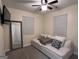Well-lit bedroom featuring neutral tones, comfortable seating, and serene decor for relaxation at 1132 Se Oak Knoll Ter, Atlanta, GA 30315