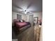 Cozy bedroom featuring a modern bed frame, soft lighting, and soothing decor for relaxation at 1132 Se Oak Knoll Ter, Atlanta, GA 30315