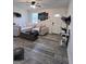 Modern living room with hardwood floors, white walls and stylish decor, and a front door at 1132 Se Oak Knoll Ter, Atlanta, GA 30315
