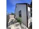 Home's side yard with a concrete path alongside the house to a fenced yard area at 1132 Se Oak Knoll Ter, Atlanta, GA 30315