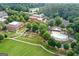 Expansive aerial view showcases community pool, garden, and well-maintained landscaping, perfect for an active lifestyle at 4128 Hunt Sw St, Covington, GA 30014