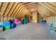Unfinished attic space, offering potential for future expansion or storage, with wooden beams at 4128 Hunt Sw St, Covington, GA 30014