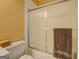 Bathroom featuring a shower with sliding glass doors, a towel rack, and a toilet at 4128 Hunt Sw St, Covington, GA 30014