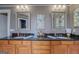Elegant bathroom featuring double sinks with granite countertops, framed mirrors, and decorative accents at 4128 Hunt Sw St, Covington, GA 30014