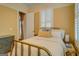 Comfortable bedroom with shuttered windows at 4128 Hunt Sw St, Covington, GA 30014
