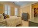 Charming bedroom with soft lighting, neutral tones, and decorative dresser at 4128 Hunt Sw St, Covington, GA 30014