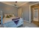 Cozy bedroom with a comfortable-looking bed, white painted wood, and a calm, neutral color scheme at 4128 Hunt Sw St, Covington, GA 30014