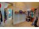 Walk-in closet offers ample storage with shelving and hanging space at 4128 Hunt Sw St, Covington, GA 30014