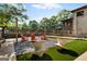 Outdoor common area with modern seating, turf, and decorative landscaping in a relaxing setting at 4128 Hunt Sw St, Covington, GA 30014