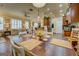 Elegant dining space with a large table, decorative place settings, and an open view to the kitchen and living area at 4128 Hunt Sw St, Covington, GA 30014